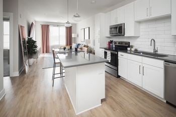 Contemporary kitchen with island seating and stainless appliances